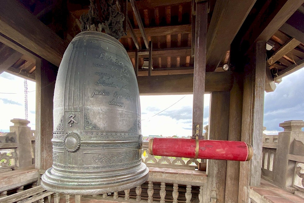 The 2-ton bronze bell features intricate carvings, symbolizing the fusion of Gothic architecture and Vietnamese culture